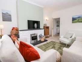 A living room with a sofa and television at 3 Nixon Terrace Broughton Moor near Maryport