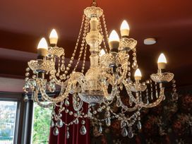 A chandelier with light bulbs and crystal beads at Wonderland in Tweedmouth, Berwick-Upon-Tweed