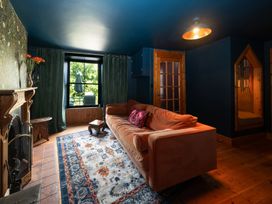 A living room with a sofa and fireplace at Wonderland in Tweedmouth, Berwick-Upon-Tweed