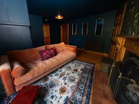 A living room with a sofa and a fireplace at Wonderland in Tweedmouth, Berwick-Upon-Tweed