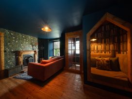 A living room with a sofa and fireplace at Wonderland, Tweedmouth, Berwick-Upon-Tweed