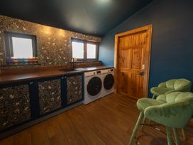 A laundry room with washing machine and dryer at Wonderland in Tweedmouth, Berwick-Upon-Tweed