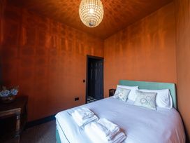 A bedroom with a bed and pillows at Wonderland in Tweedmouth, Berwick-Upon-Tweed