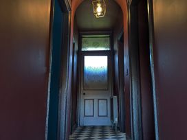A hallway with a door and lamp at Wonderland in Tweedmouth, Berwick-Upon-Tweed