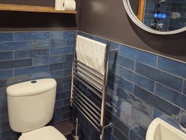A bathroom with a toilet and towel rail at Wonderland in Tweedmouth, Berwick-Upon-Tweed