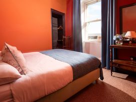 A bedroom with a bed and window at Wonderland in Tweedmouth, Berwick-Upon-Tweed