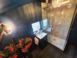 A bathroom with a shower and sink at Wonderland in Tweedmouth, Berwick-Upon-Tweed