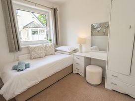 A bedroom with a bed and desk at Oaklea in Keswick