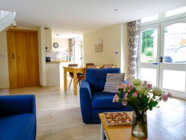 A living room with a sofa and table at Gelli Barn near Llandeilo