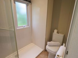 A bathroom with a shower and toilet at 41, Grandma's Cottage near South Lakeland Leisure Village