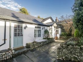 An outdoor area of a house with a path and plants at Clarence House in Dalton-In-Furness