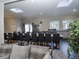 A kitchen with a dining table and chairs at Clarence House in Dalton-In-Furness