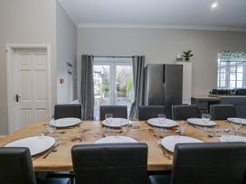 A dining room with a table set for dinner at Clarence House Dalton-In-Furness