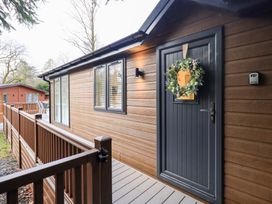 An entrance with a door and wreath at Unique Luxury Lodge, 1 Langdale, White Cross Bay near Windermere