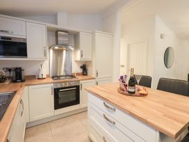 A kitchen with modern appliances at Unique Luxury Lodge, 1 Langdale, White Cross Bay near Windermere