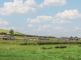 A view of several houses alongside a road in a rural area at Ty Crwn Lampeter
