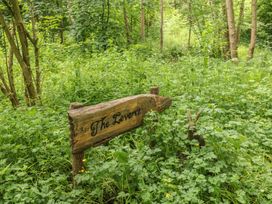 A wooden sign in the forest indicating The Leveret in Eppleby
