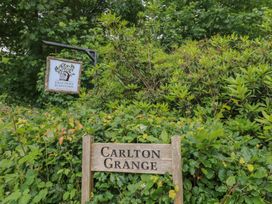 A sign indicating Carlton Grange and Keld Down Plantation