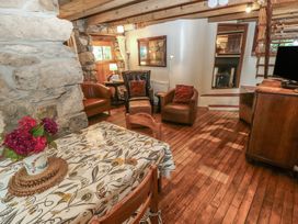 A living room with a table and chairs at Penfeidr Newydd, Carningli Common, Newport, Pembrokeshire