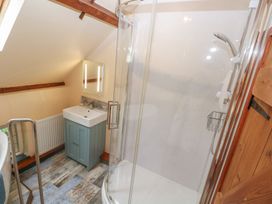 A bathroom with a shower and sink at Penfeidr Newydd, Carningli Common, Newport, Pembrokeshire