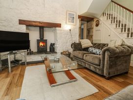 A living room with a sofa and coffee table at Glenside House in Carbis Bay