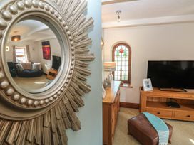 A living room with a television and couch at Riviere House Hayle