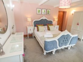 A bedroom with a bed and bedside table at Riviere House in Hayle