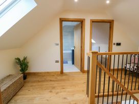 A landing area with doors and a plant at Y Beudy near Llanilar