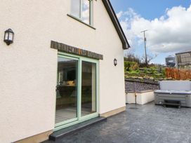 An outdoor area with a door and window at Y Beudy near Llanilar