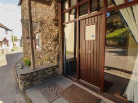 An entrance with a door and a doormat at Beck Edge in Braithwaite