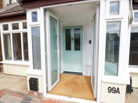 An entrance with a door and windows at The Golden Cross Cottage Evesham