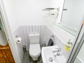 A bathroom with a toilet and sink at The Golden Cross Cottage in Evesham