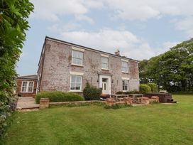 A house with a garden and patio area at The Grange in Flamborough
