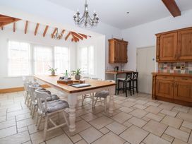 A kitchen with table and chairs at The Grange in Flamborough