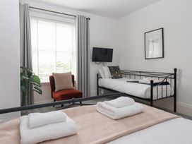 A bedroom with a double bed and a single bed at The Grange in Flamborough