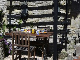 A table with drinks and food in an outdoor dining area at 33 High Street Fortuneswell