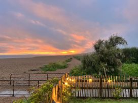 A beach scene with a path and fence at Agua de Plata, 16 Wakeling Island, Silverlake Dorchester