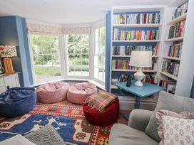 A snug with bean bags and bookshelf at Syleham House Syleham near Eye