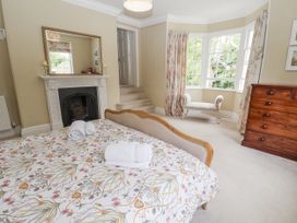 A bedroom with a bed and a chest of drawers at Syleham House Syleham near Eye
