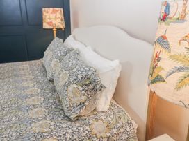 A bedroom with a bed and pillows at Syleham House in Syleham near Eye