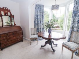 A sitting room with a table and chairs at Syleham House in Syleham near Eye
