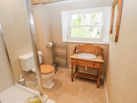 A bathroom with a shower, toilet, and sink at Syleham House in Syleham near Eye