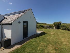 A house exterior with a door and a window at Bwthyn Y Swnt Moelfre