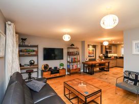 A living room with a sofa, coffee table, and television at The Beach Retreat The Bay - Filey