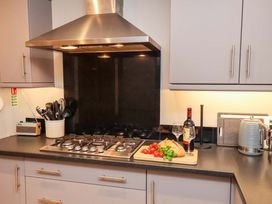 A kitchen with cooking utensils and a gas stove at The Beach Retreat The Bay - Filey