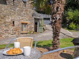 An outdoor area with pastries and coffee cups at Little Coombe in Trehunist near Liskeard