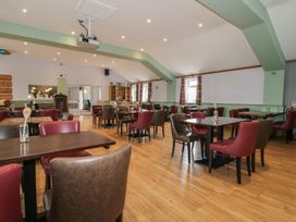 A dining room with tables and chairs at Swan in Shobdon