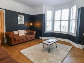 A living room with a sofa and coffee table at Sunrise House in Pakefield near Lowestoft