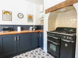A kitchen with a countertop and oven at Sunrise House in Pakefield near Lowestoft
