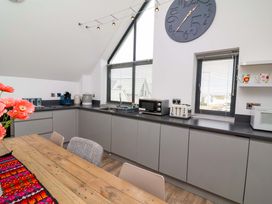 A kitchen with cabinets, sink and appliances at Pebble Ridge View in Westward Ho!